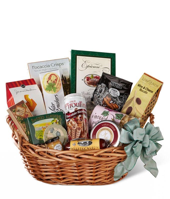 Biscuits, Cheeses, Crackers, Pretzels, Sausage and Chocolate Cake in a Woven Basket