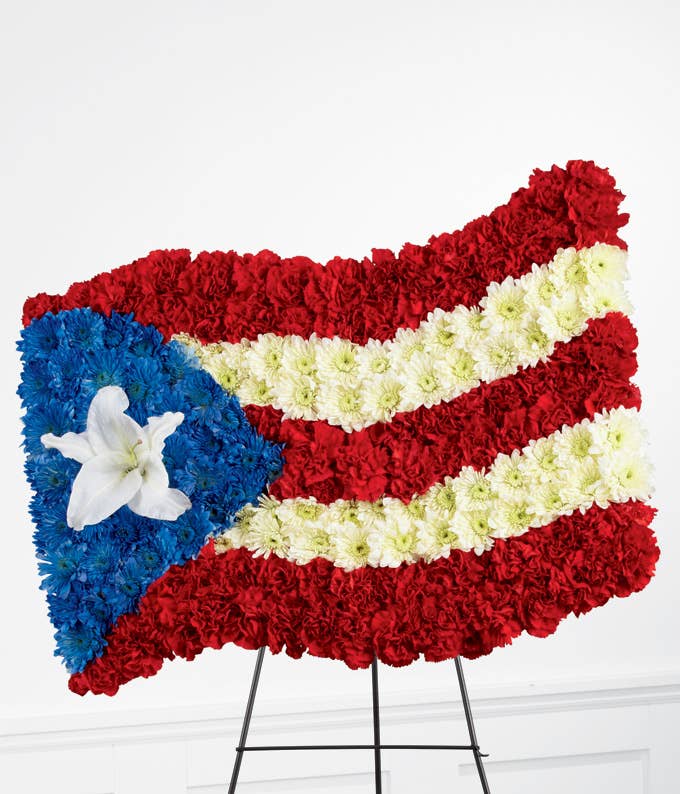 A Flag Flower Arrangement Including Red Carnations, White Mums, and White Oriental Lily Stand Included