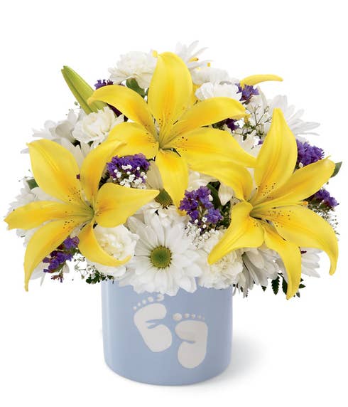 White daisies and yellow lilies in baby boy bouquet