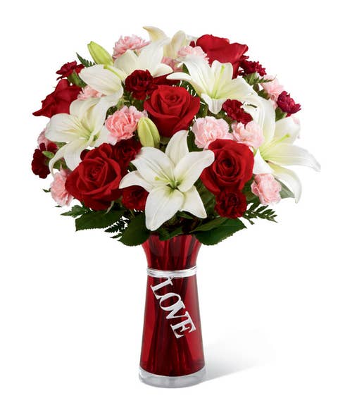 White lily and red rose bouquet with dangle love text tag in red vase