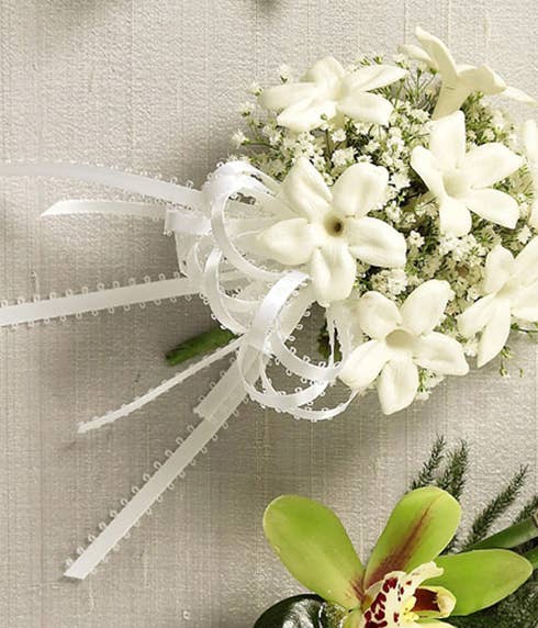 White flower corsage with cheap flowers and white stephanotis for same day delivery