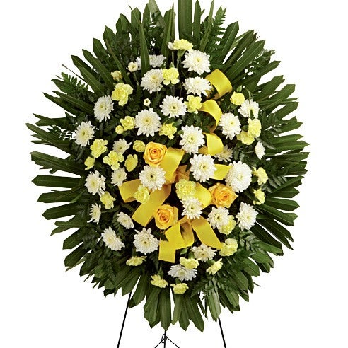 Flower Arrangement Including Yellow Roses, Golden Mini Carnations, White Chrysanthemums, and Fresh Greens with Yellow Satin Ribbin and Stand Included