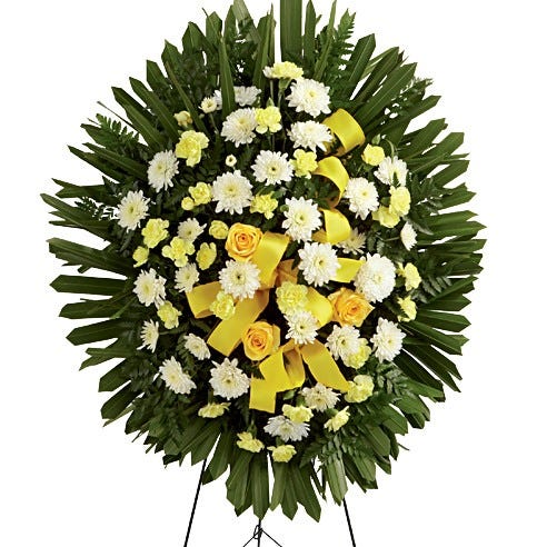 funeral spray with yellow flowers
