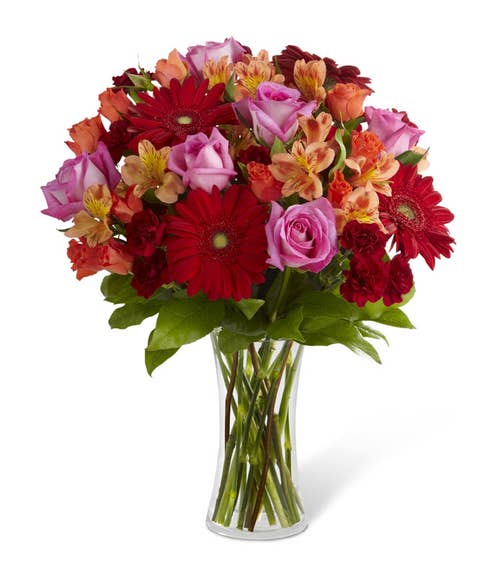 Dark red gerbera daisy bouquet with orange alstroemeria and hot pink roses