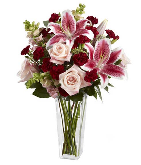 Pale pink roses, Stargazer lilies and burgundy mini carnations bouquet