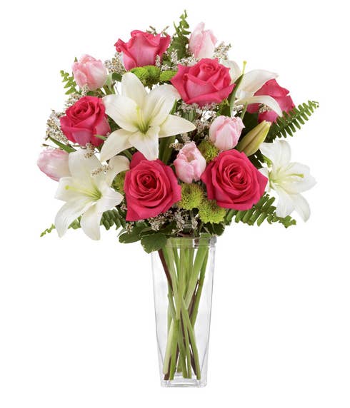 Fuchsia roses and light pink tulips bouquet with white asiatic lily and green vase