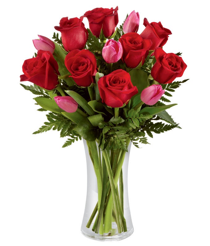 A Bouquet of Dark-Red Roses, Fuchsia Tulips,  and Lush Greens in a Clear Glass Vase with Card Message