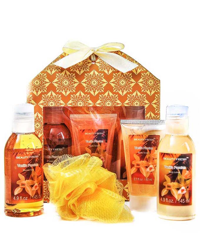 Vanilla body scrub, gel, lotion, and loofah sponge in a spa gift