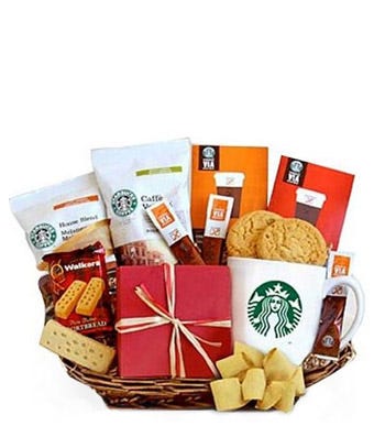 Assortment of Starbucks Coffee and Assortment of Sweet Treats with Starbucks Mug in a basket