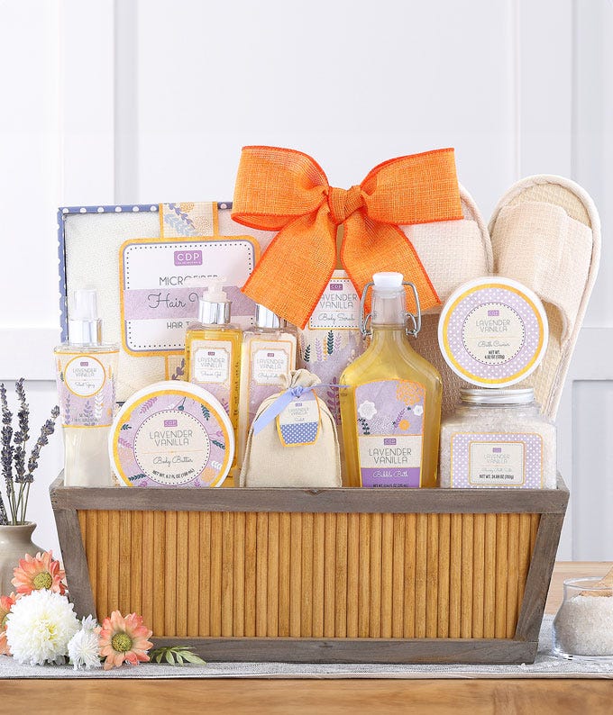 Mother's Day spa gift basket with an array of lavender vanilla scented Cru De Provence products, slippers, and bath accessories in a Relax gift container, including a personalized message card.