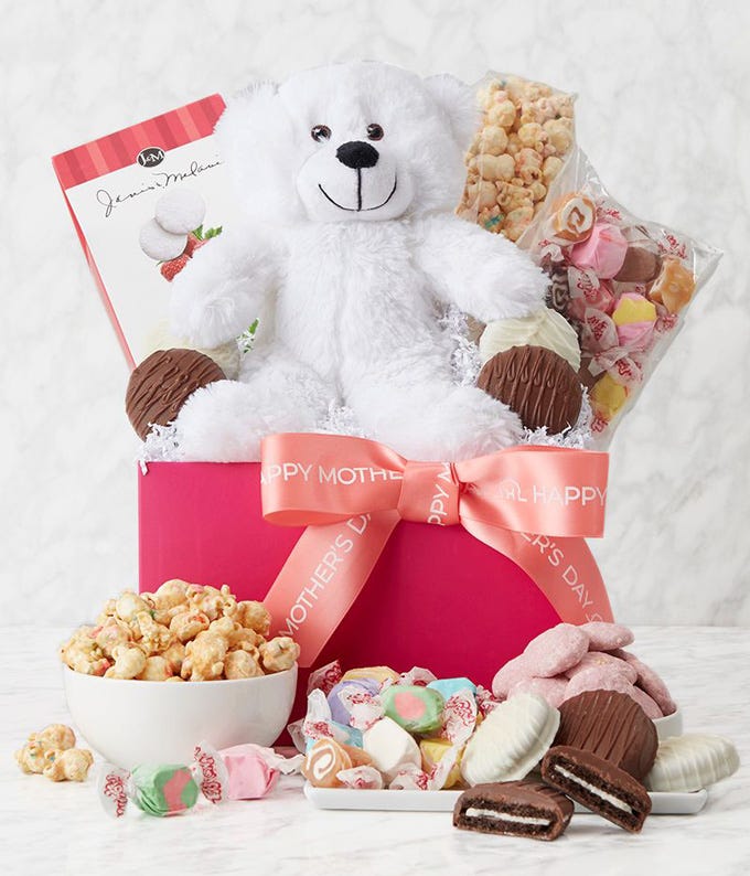 Mother's Day pink gift box filled with white and milk chocolate dipped Oreos, confetti cake popcorn, raspberry cookies, taffy, and a white stuffed bear, including a personalized card message.