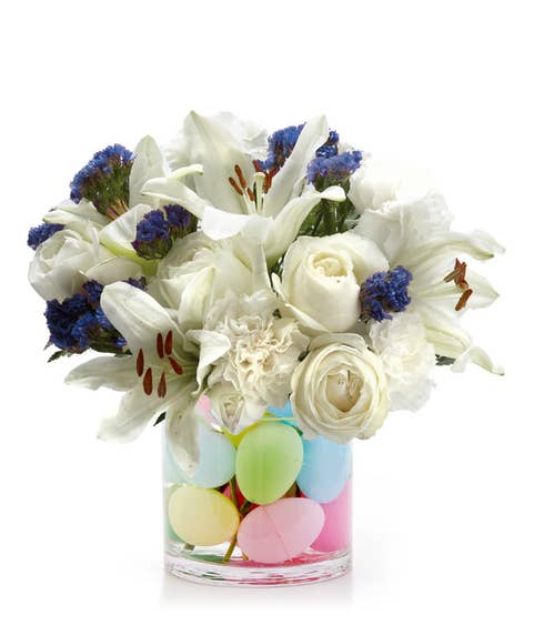cheap easter flowers delivered in a white rose and lily egg flower bouquet