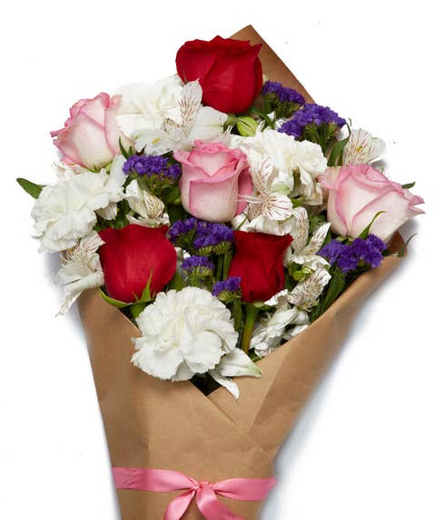 Wrapped flowers same day delivery with red roses, pink roses and carnations