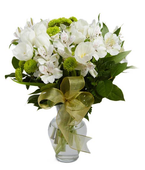 White tulips, white alstroemeria and green poms in a vase