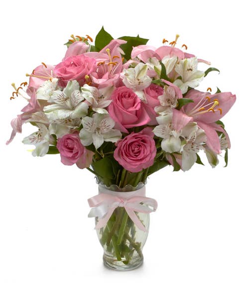 Spring flower bouquet with pink roses, pink lily and white alstroemeria 