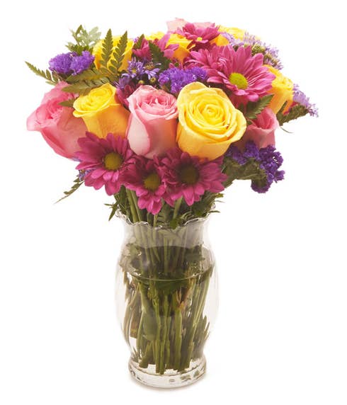 Mixed yellow and pink roses with pink daisies