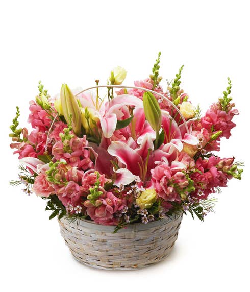 Pink stargazer lily basket arrangement with pink stargazer lilies and snapdragons