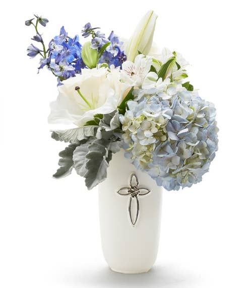 Cross flower bouquet with blue hydrangea and delphinium 