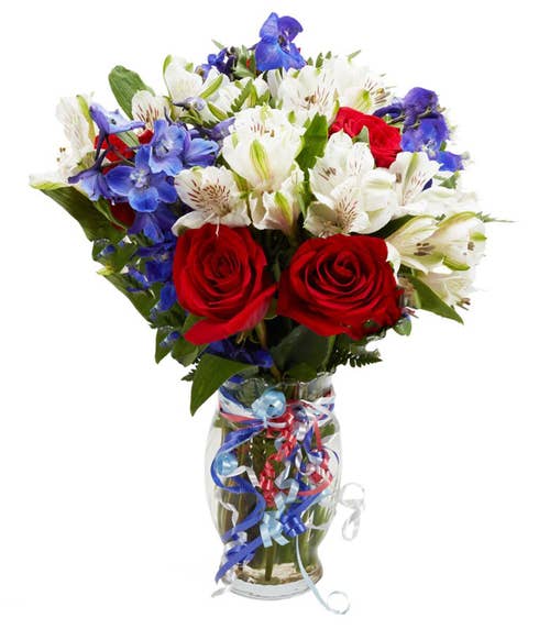 Military flower bouquet with red white blue flowers, red roses and blue delphinium