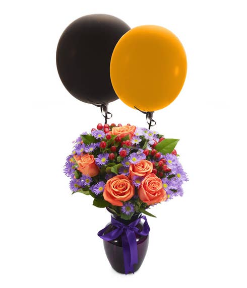 Orange roses with petite purple flowers with balloons