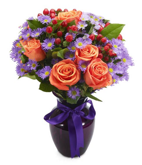 Orange and purple bouquet with orange roses and purple monte casino flowers