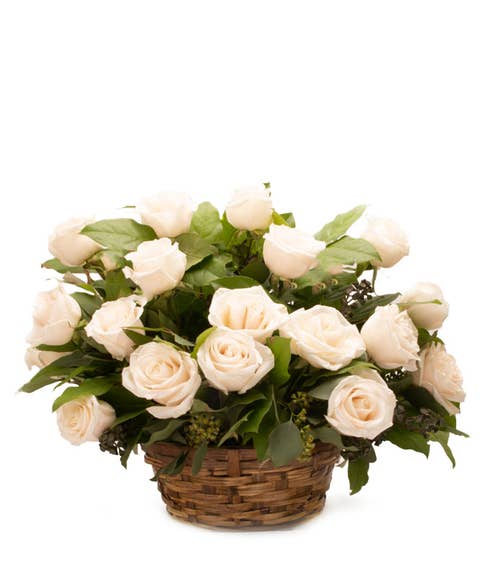 White rose bouquet basket with white roses, woven basket and card message