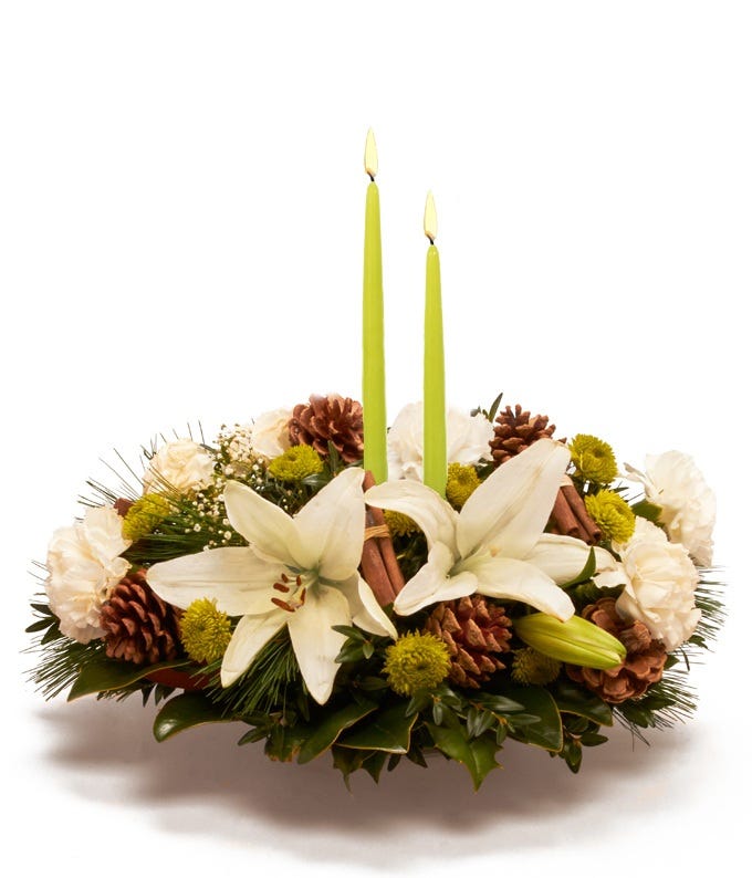 Green flower candle centerpiece with white lily and carnations and green poms