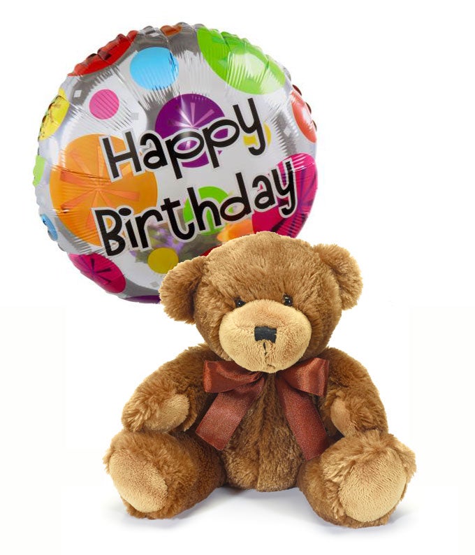 Brown teddy bear and a Happy Birthday round balloon tied on it using a decorative ribbon