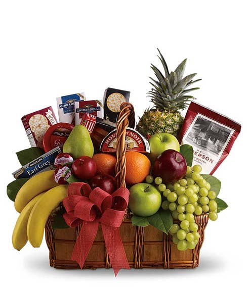 Gourmet fruit basket with fruits, cheese and crackers, chocolate and snacks