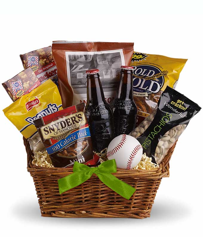Sporty gift basket with root beer, nuts, in and other snacks in a woven basket