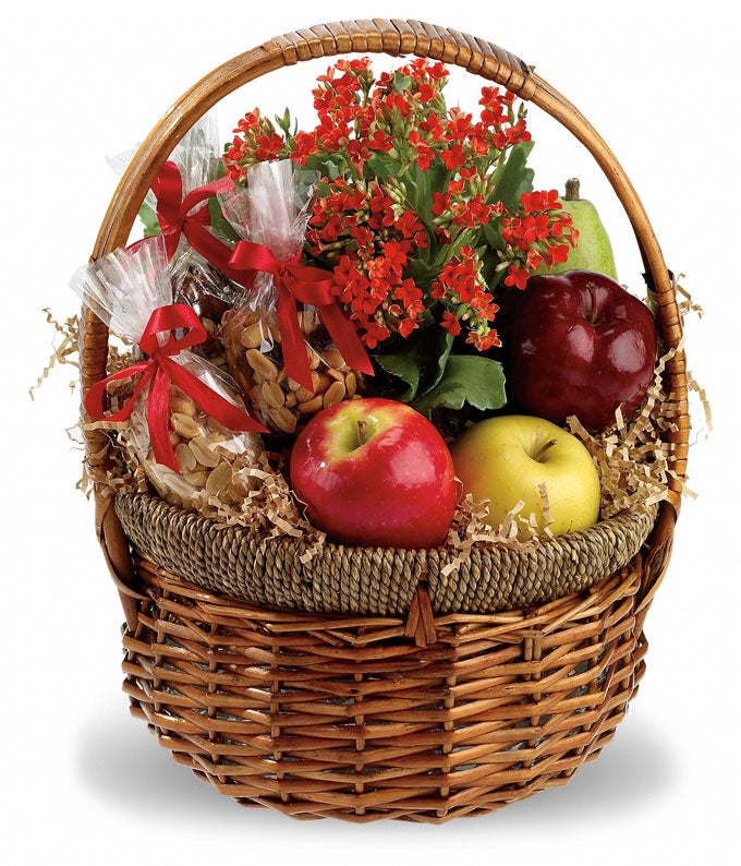 A Basket Including Mixed Nuts, Orange Kalanchoe Plant, Trail Mix, Peanuts, and Assorted Fruits