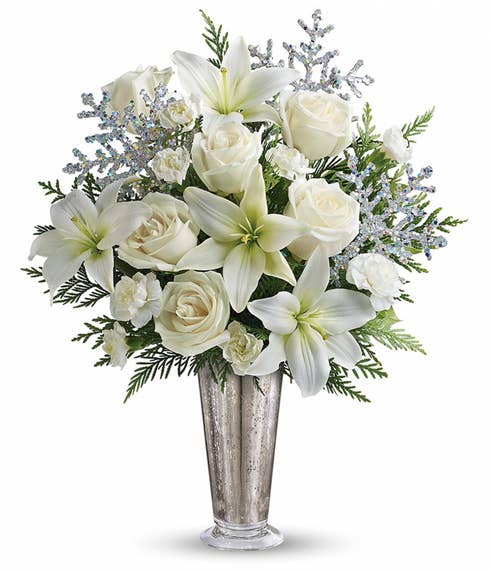 White lily and white roses winter flowers bouquet with sparkle silver vase