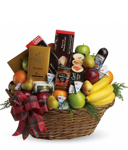 Chocolate and fruit gifts basket with chocolate, bananas, pears and oranges
