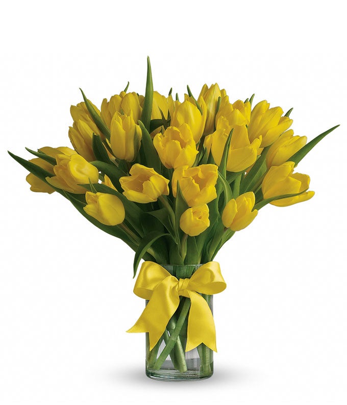 A Bouquet of Yellow Tulips in a Glass Vase