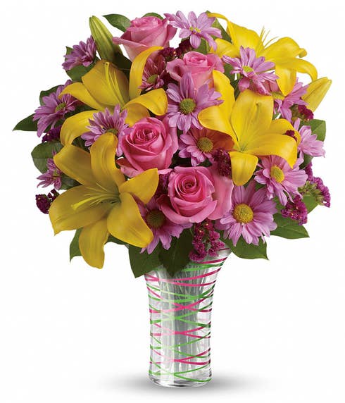 Candy pink and yellow flower bouquet with glass vase