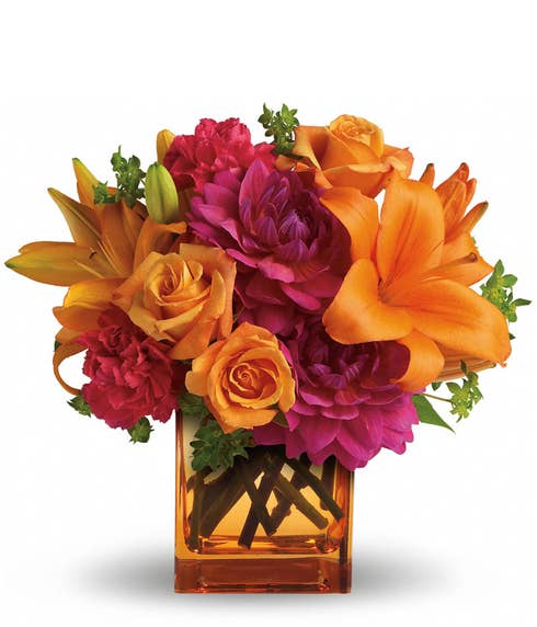 Orange flower bouquet with orange lily, orange roses, orange vase