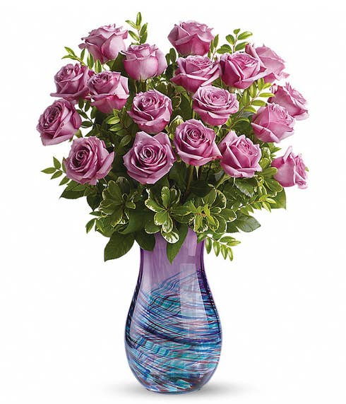 Long stem purple roses bouquet with blue and purple swirl design glass vase