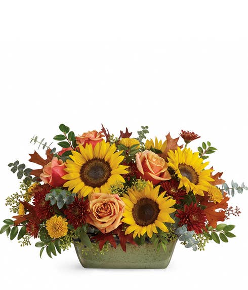 Sunflower centerpiece with orange roses, yellow mums and burgundy chrysanthemums