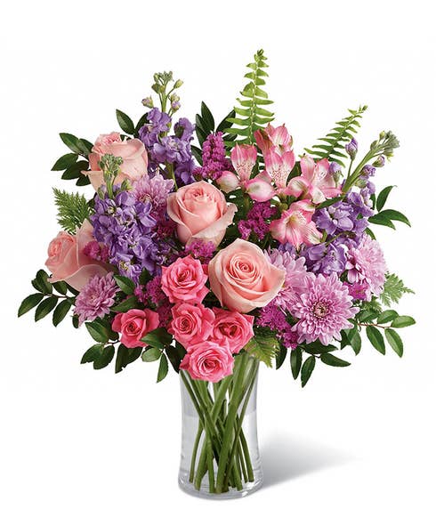 Spring flowers bouquet with pink roses, alstroemeria and pastel flowers