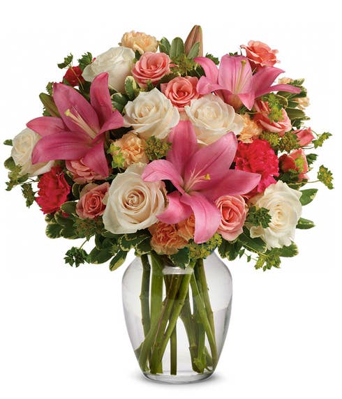Mixed flower bouquet with pink lily, pale roses and miniature spray roses