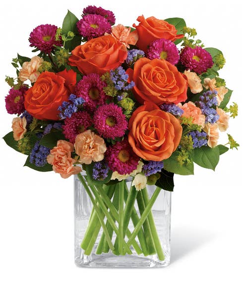 Mixed bouquet of orange roses, hot pink matsumoto asters and buplerum