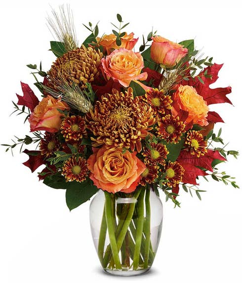 Rust chrysanthemum flower bouquet with fall flowers and orange roses