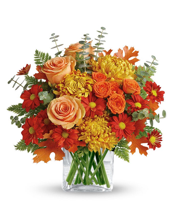 Fall orange flower bouquet with pale orange roses and orange chrysanthemums