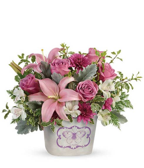 Pink lily lavender roses bouquet in a butterfly print keepsake vase