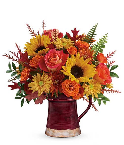 Orange rose and sunflower mug arrangement with brown daisies and brown mums