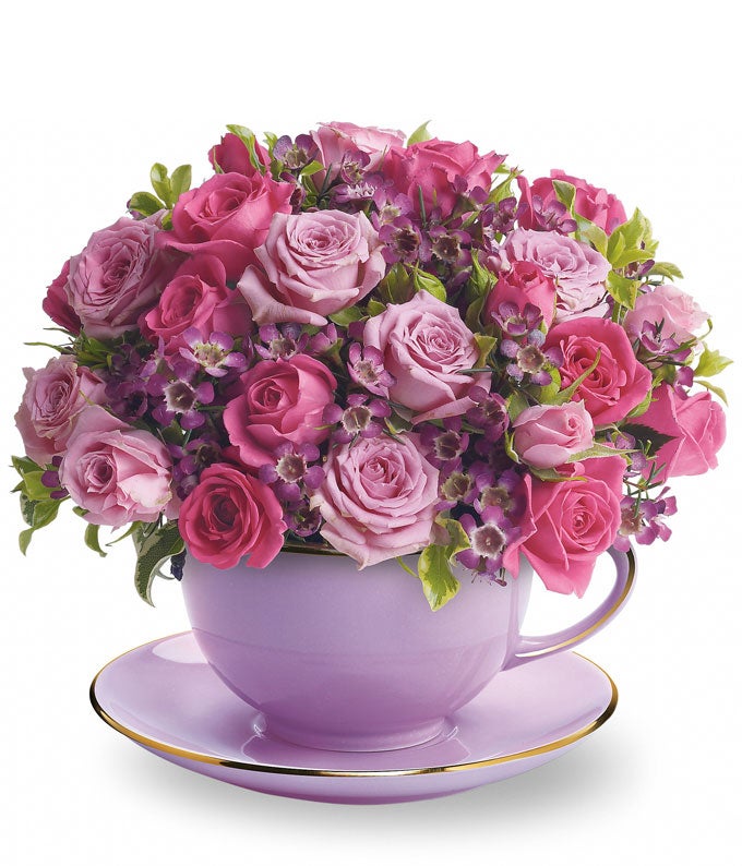 A Bouquet of Lavender Roses, Pink Roses, Waxflowers and Pitta Negra in a Teacup with Saucer