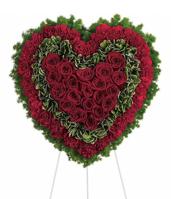 Heart-Shaped Flower Arrangement Including 20 Crimson Roses, 32 Red Carnations, Variegated Pittosporum, and Ming Fern with Easel Stand Included