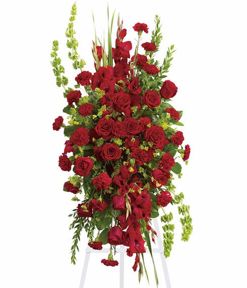Funeral oval red rose standing spray delivery with roses and gladioli