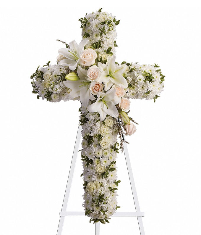 Cross Flower arrangement including Cream Roses, White Spray Roses, Ivory Oriental Lilies, Milky Stock, Alabaster Button Spray Poms and Fresh Cut Greenery