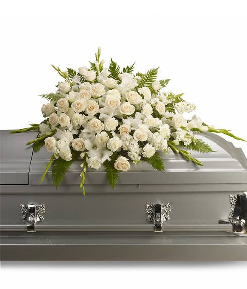 Funeral coffin sprays at send flowers like this white standing spray